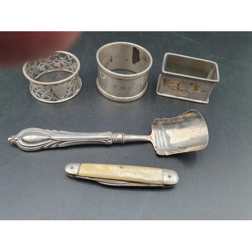 107 - A Victorian silver Caddy Spoon, Birmingham 1868, maker: George Unite, three silver Napkin Rings and ... 