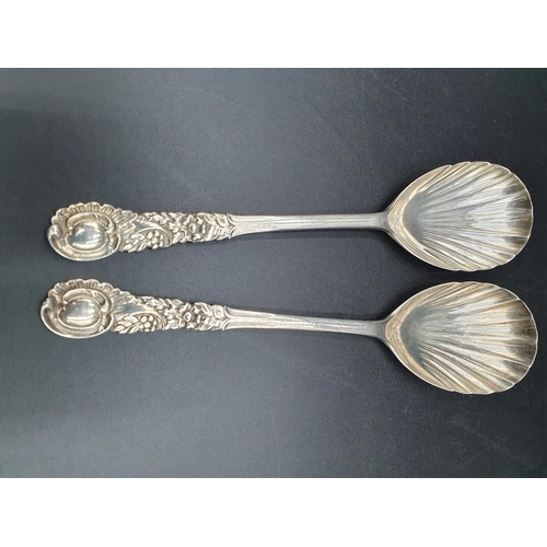 113 - A pair of Edward VII silver Serving Spoons with scallop bowls and floral decorated stems, London 190... 