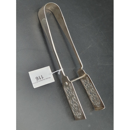 116 - A pair of George V silver Asparagus Tongs with leafage scroll pierced blades, London 1921