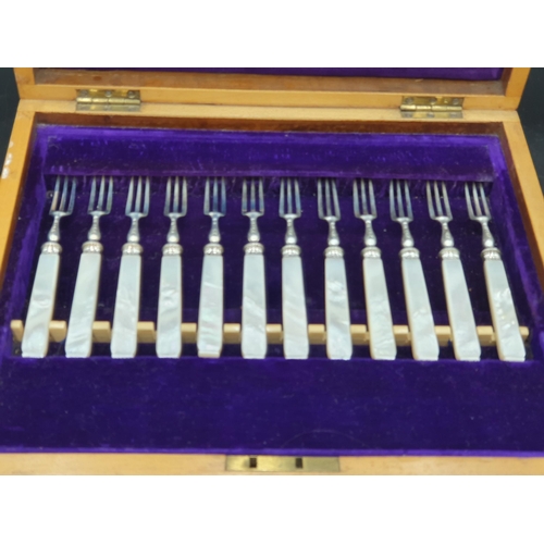 119 - One dozen Victorian Dessert Knives and Forks with engraved silver blades and mother of pearl hafts, ... 