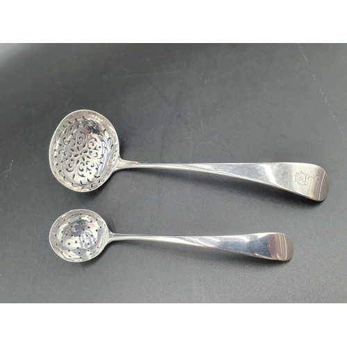 129 - A Victorian silver Sifting Ladle old English pattern engraved crest, London 1858, and another, small... 