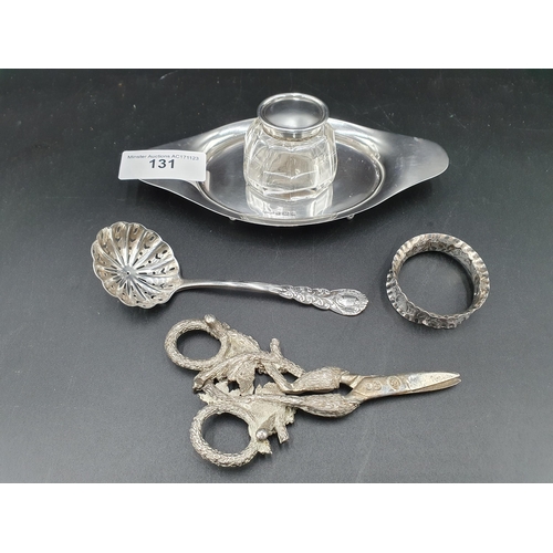 131 - An Edward VII oval Inkstand with silver lidded glass Ink Bottle, Birmingham 1904 a Sifting Spoon, Lo... 