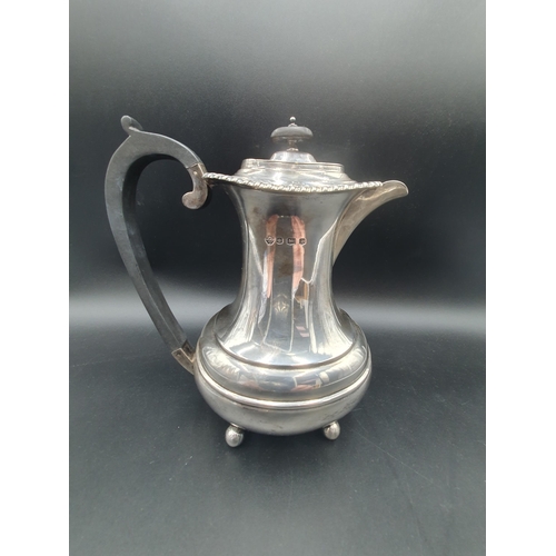 135 - A George V silver Coffee Pot with gadroon rim, interior silver strainer, raised on ball feet, Sheffi... 