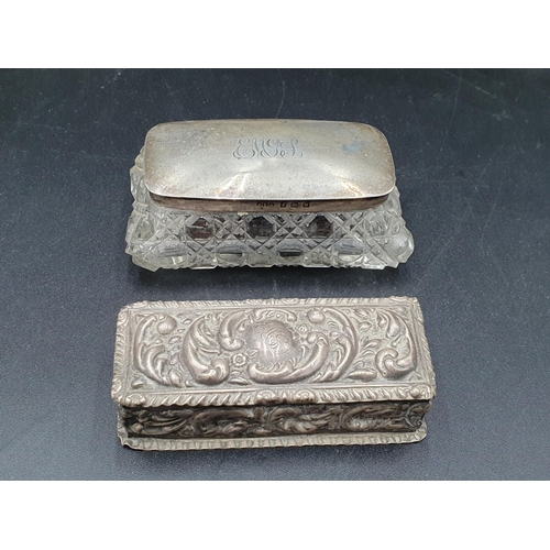 140 - An Edward VII silver Trinket Box with leafage scroll embossing, Birmingham 1903, and a silver lidded... 