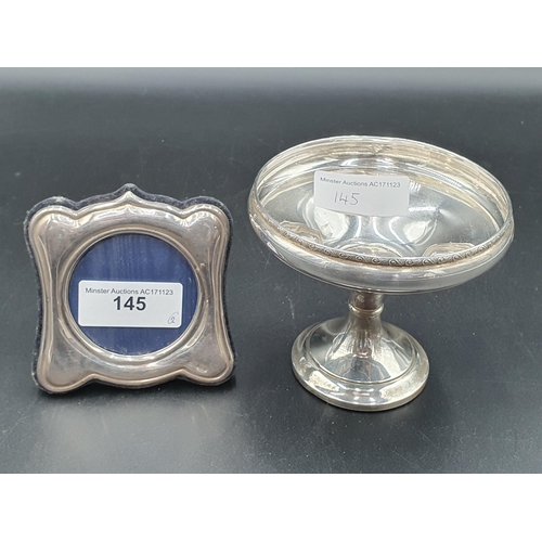 145 - An Elizabeth II silver Pedestal Dish, Sheffield 1973 and a small silver Photograph Frame, Birmingham... 
