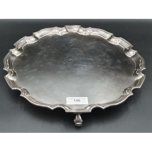 146 - A George V silver shaped circular Salver on four scroll feet, Birmingham 1930, 14in diam, 1150gms