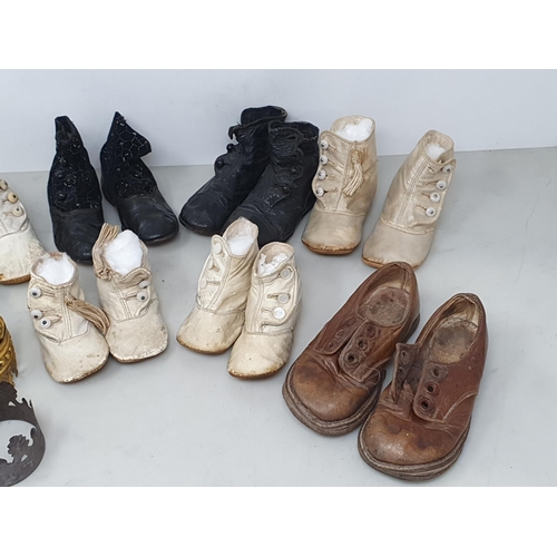 149 - Six pairs of Doll's Shoes, a pair of child's Shoes and four miniature Crowns