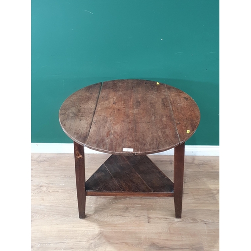 2 - An oak Cricket Table with circular top and lower tier 2ft 7in D x 2ft 6in H (R4)