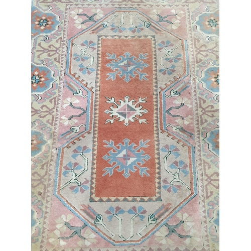 25 - A pink ground Rug with floral border 6ft L x 4ft W (R3)
