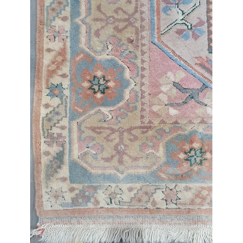 25 - A pink ground Rug with floral border 6ft L x 4ft W (R3)