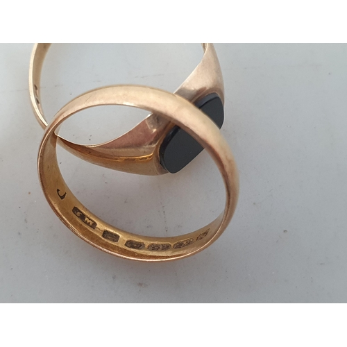 251 - A 22ct gold Wedding Band, 2.9gms, and two 9ct gold Signet Rings, one inset black stone, 4.7gms (3)