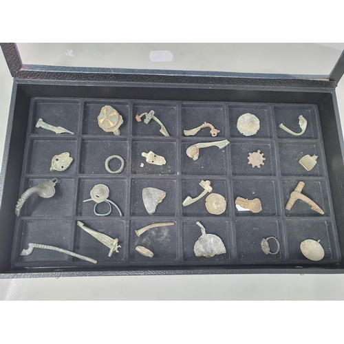 274 - A Collection of mainly Roman Artefacts including Fibula Brooches, an enamel Disc Brooch, and fragmen... 