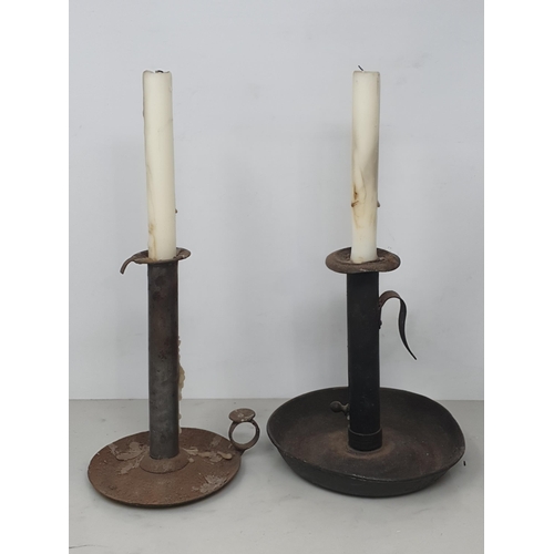 30 - Three antique metal Candlesticks, an antique Rush Light and a box of Candles