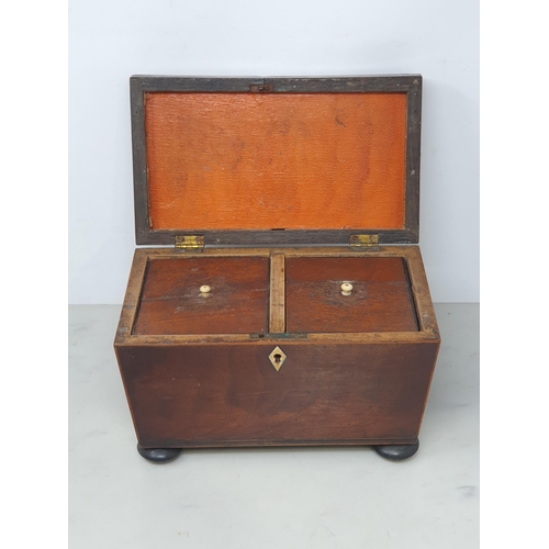 38 - A 19th Century mahogany two division Tea Caddy on bun feet, a mahogany Stationary Box and a miniatur... 