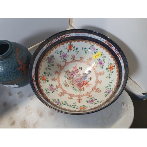 388 - A Chinese Bowl, the interior painted figures in a landscape, surrounded by flowers and gilding, the ... 