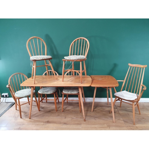 543 - An Ercol elm Dining Table 4ft 6in L x 2ft 4in H and six Ercol stick back Chairs (R4)