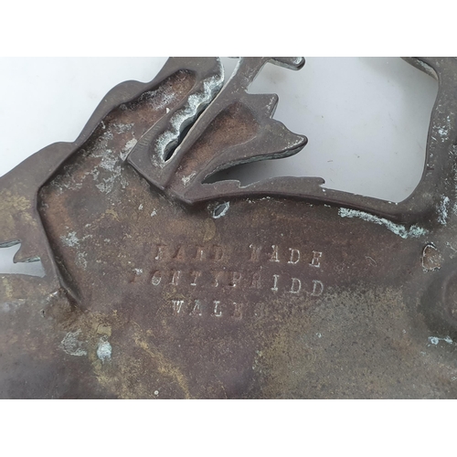 544 - A cast bronze Welsh Dragon stamped 'Hand made Pontypridd Wales' to reverse 10in, a taxidermy Grey He... 