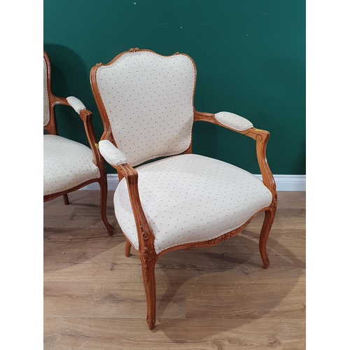 547 - Two French beech framed Elbow Chairs with cream upholstery raised on cabriole supports 2ft 10in H (R... 