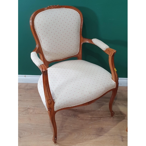 547 - Two French beech framed Elbow Chairs with cream upholstery raised on cabriole supports 2ft 10in H (R... 