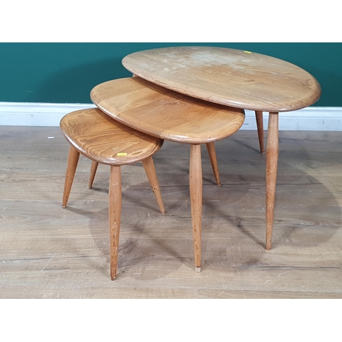 610 - A nest of three Ercol elm pebble Tables (R7)