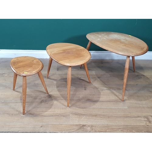 610 - A nest of three Ercol elm pebble Tables (R7)