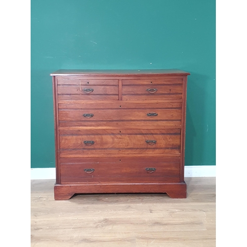 658 - An Edwardian walnut Chest of two short and three long drawers on bracket supports, 3ft 4in W