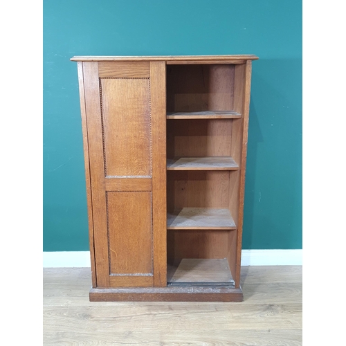 684 - A small oak Cupboard with sliding doors enclosing shelves on plinth base, 4ft H x 2ft 8in W, (R8)