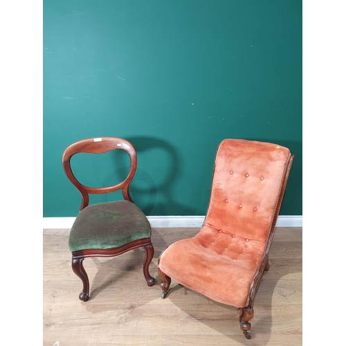 702 - A Victorian button upholstered Nursing Chair with peach coloured upholstery and a Victorian balloon ... 