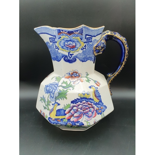 71 - A Mason's ironstone octagonal Ewer with overpainted bird and floral transfer, serpent handle, 11in, ... 