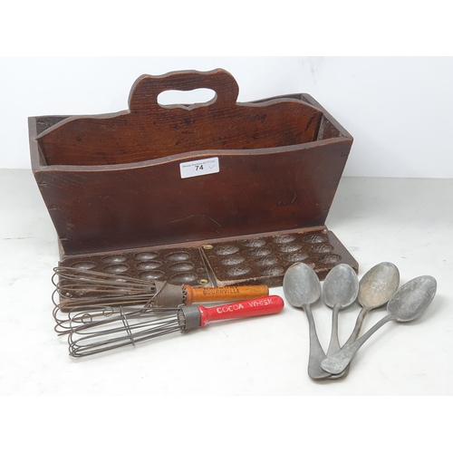 74 - An antique oak two division Cutlery Tray chocolate Egg Mould, a Cadbury's Whisk, a Bourneville Cocoa... 