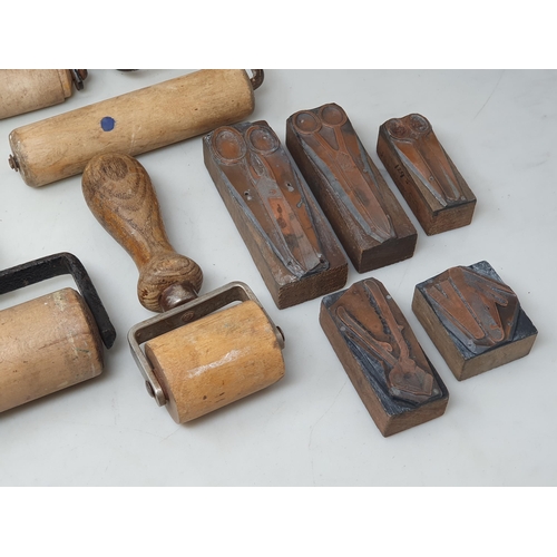 79 - Two wooden Breadboards, five printing ink Rollers and five Printing Blocks depicting tools