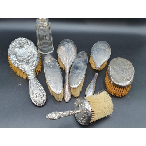 85 - Seven various silver mounted Brushes, a Comb Holder and a silver mounted cut glass Jar, some A/F