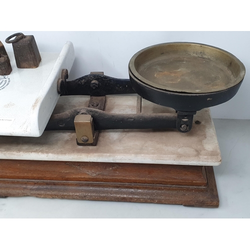88 - A Victorian set of Scales by Hunt & Co. with three weights (ceramic plate A/F)