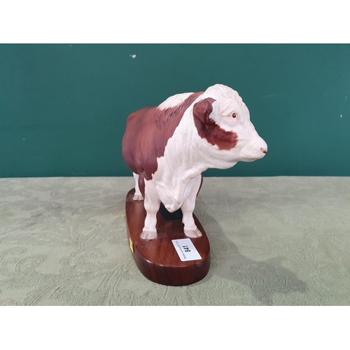 841 - A Connoisseur model by Beswick of a polled Hereford Bull on wooden plinth, 11in