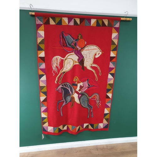 830 - A Woolwork Wall Hanging depicting Knights on horse back, supported on a pole, 6ft 4in x 4ft (R11)