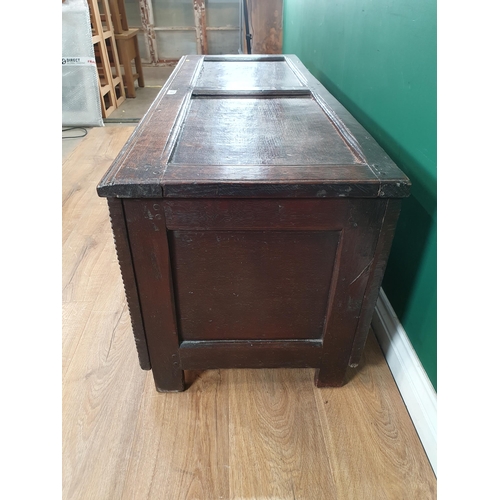 833 - A 17th Century oak Coffer with panelled top and boarded front 4ft 2in W (R11)