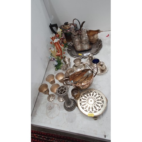 399 - Silver plated items including, a three piece Coffee Set, Cruet, four continental ceramic Figure Vase... 