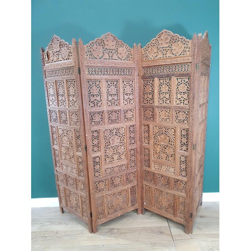 831 - An Eastern hardwood four-fold Screen with pierced and scrolled floral designs, 5ft 9in H (R11)