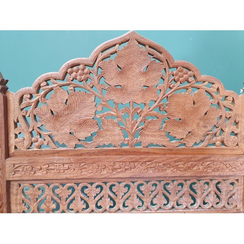 831 - An Eastern hardwood four-fold Screen with pierced and scrolled floral designs, 5ft 9in H (R11)