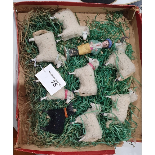 75 - A flock of eight antique toy plaster Sheep with Shepheard contained in damaged box with lid depictin... 