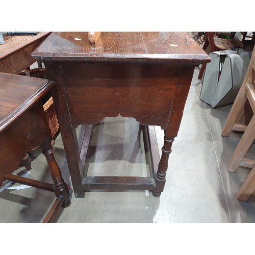 659 - An 18th Century oak Dresser Base, fitted two frieze drawers on baluster turned supports and squared ... 