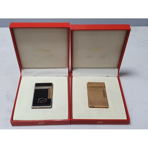 240 - Five Dupont Cigarette Lighters; three gold plated, one white metal, one black enamel