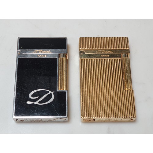 240 - Five Dupont Cigarette Lighters; three gold plated, one white metal, one black enamel