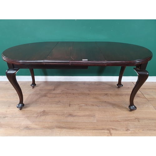 17 - A small 1920's stained wood extending Dining Table with rounded rectangular top on cabriole supports... 