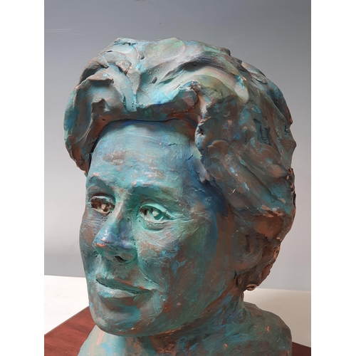 504 - A painted Bust of a Lady mounted on rectangular wooden plinth, 1ft High x 1ft Wide including the pli... 