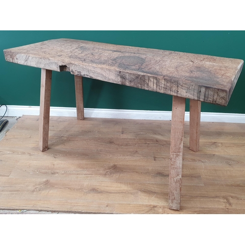 523 - A primitive Butcher's Block with single piece oak top on squared supports 4ft 11in W x 2ft 7in H (R2... 