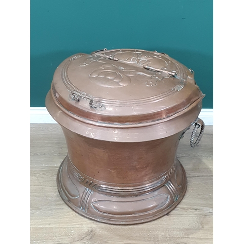 528 - A large Art Nouveau copper Log Cauldron, circular with hinged cover, ring handles and Art Nouveau de... 