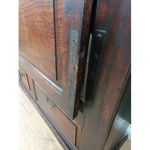 2 - A large antique oak Cupboard with a pair of panelled doors and with three drawers to the base, 6ft 1... 