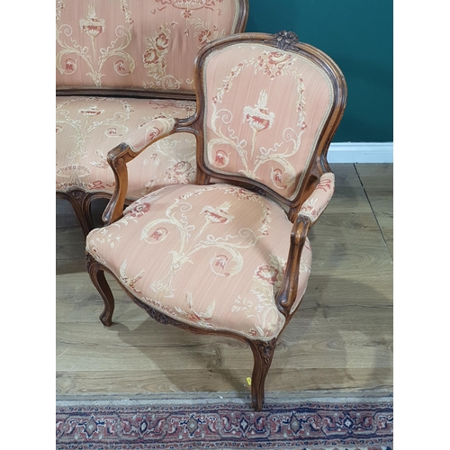 625 - A walnut framed French style three piece Suite having carved floral design top rails with pink flora... 