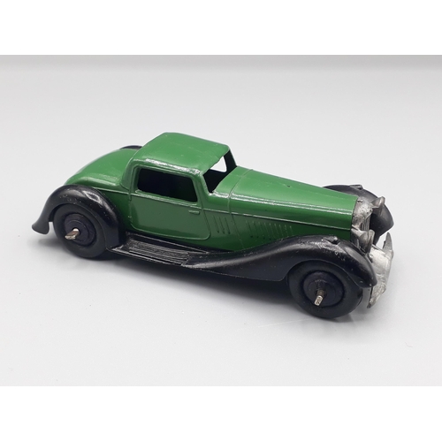 1129 - An unboxed Dinky Toys 36b dark green Bentley, Nr M-M